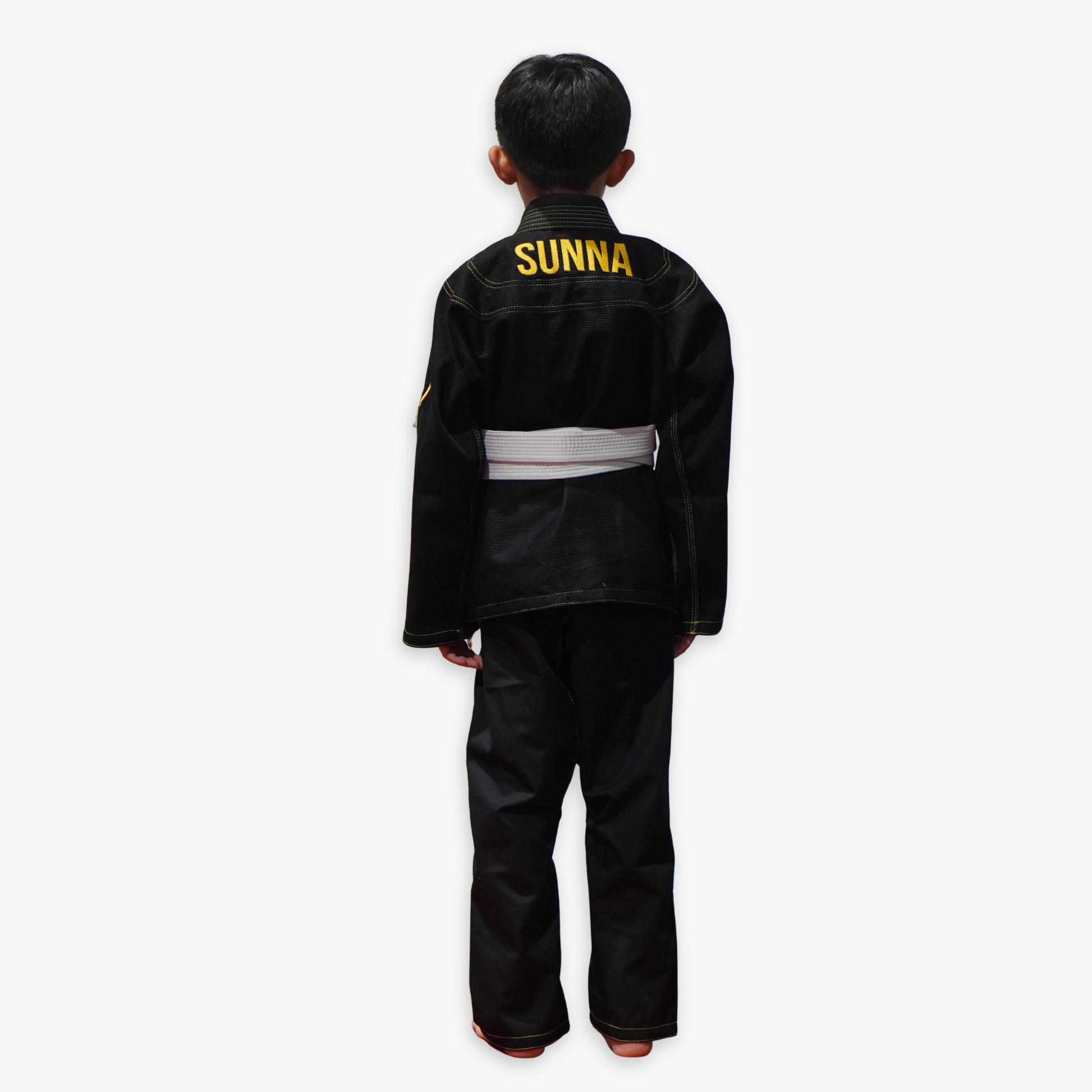Child wearing a black 'Sunna' martial arts uniform on a white background