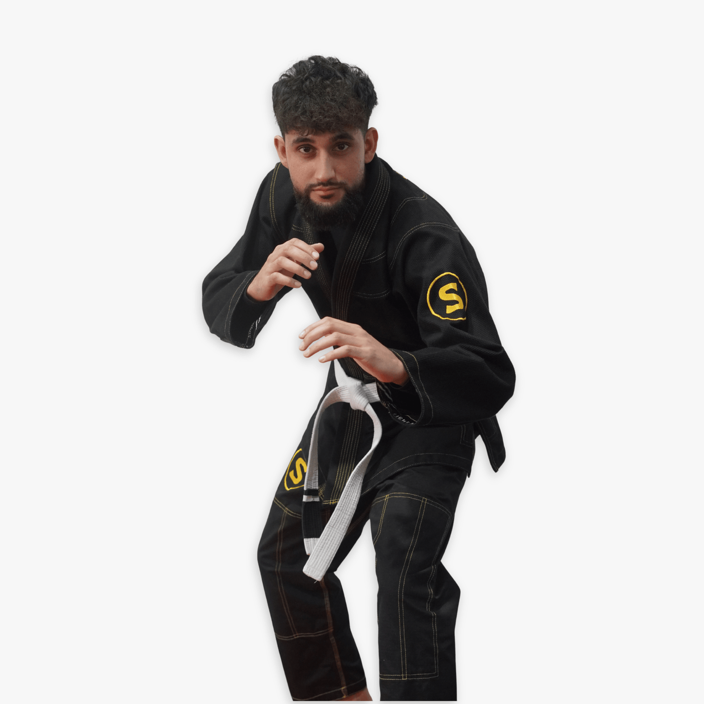 Sunna Fightwear black gi in action - premium BJJ uniform for Brazilian Jiu-Jitsu training and belt promotion
