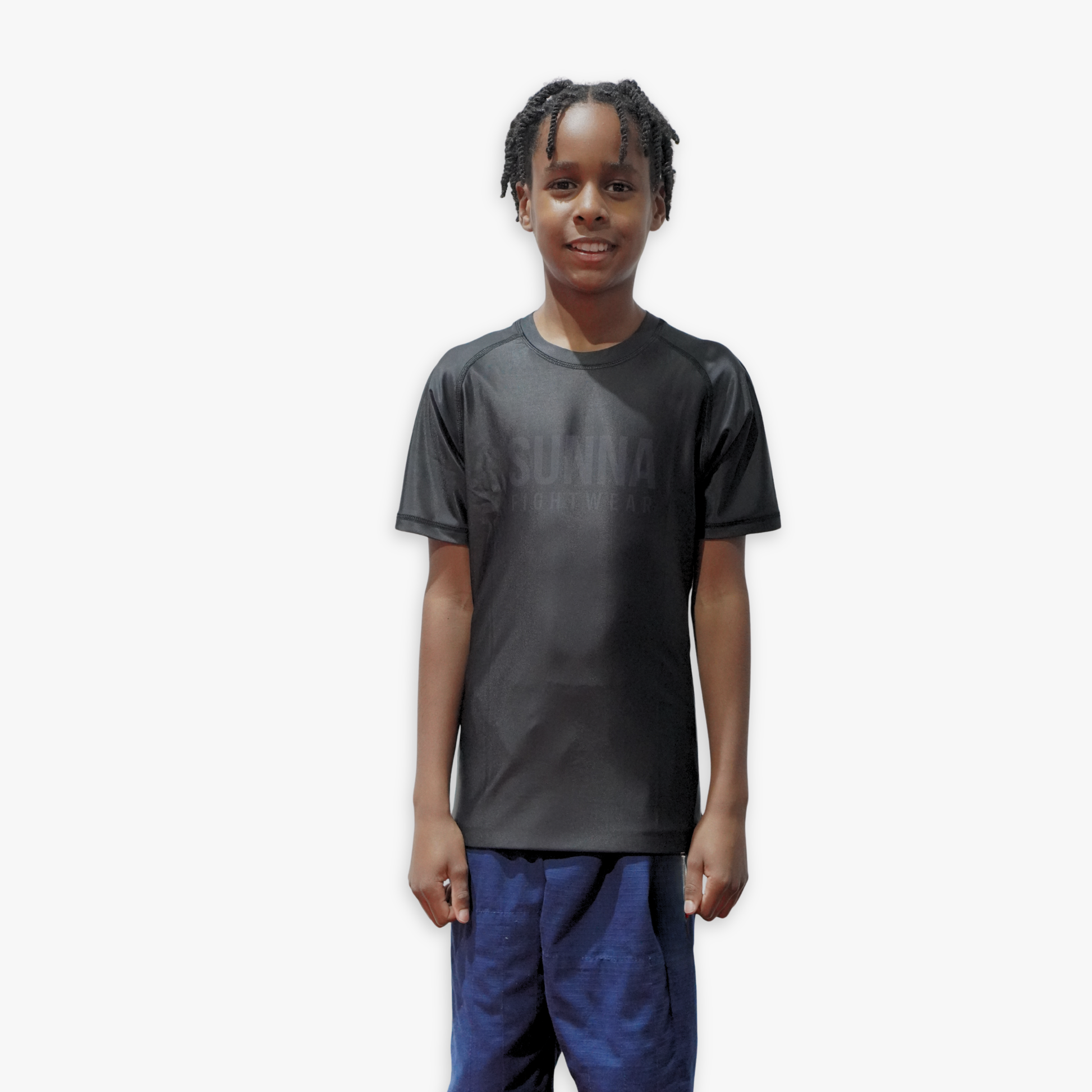 Child wearing a black rashguard on a white background