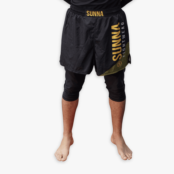 Awrah hybrid fight shorts front view - Sunna Fightwear modest BJJ shorts with extended length for halal training
