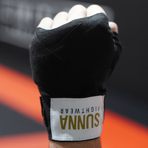 Boxing hand wraps on fist - Sunna Fightwear 5m elastic cotton wraps for wrist support and knuckle protection