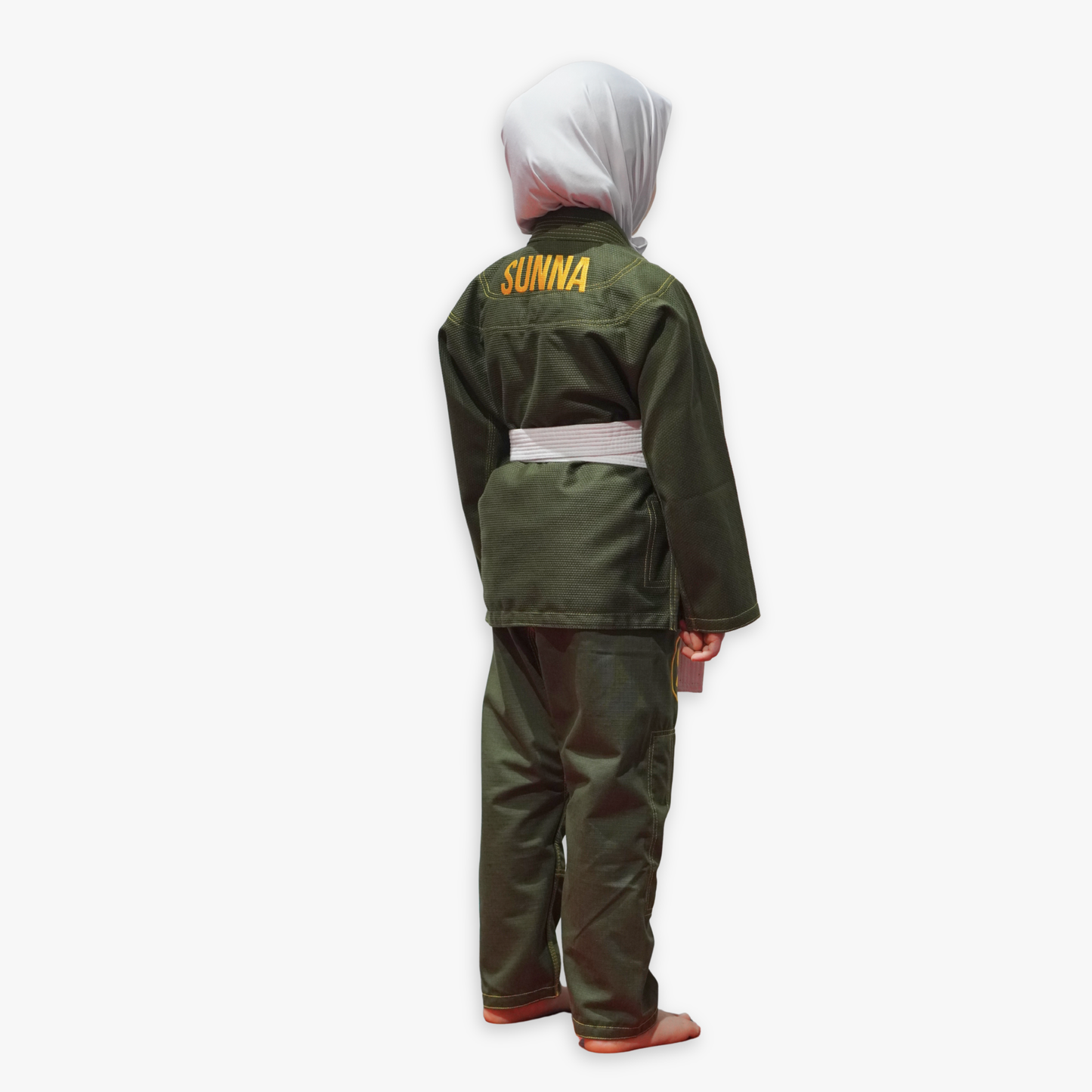 Child wearing a green martial arts uniform with 'SUNNA' branding on the back against a white background