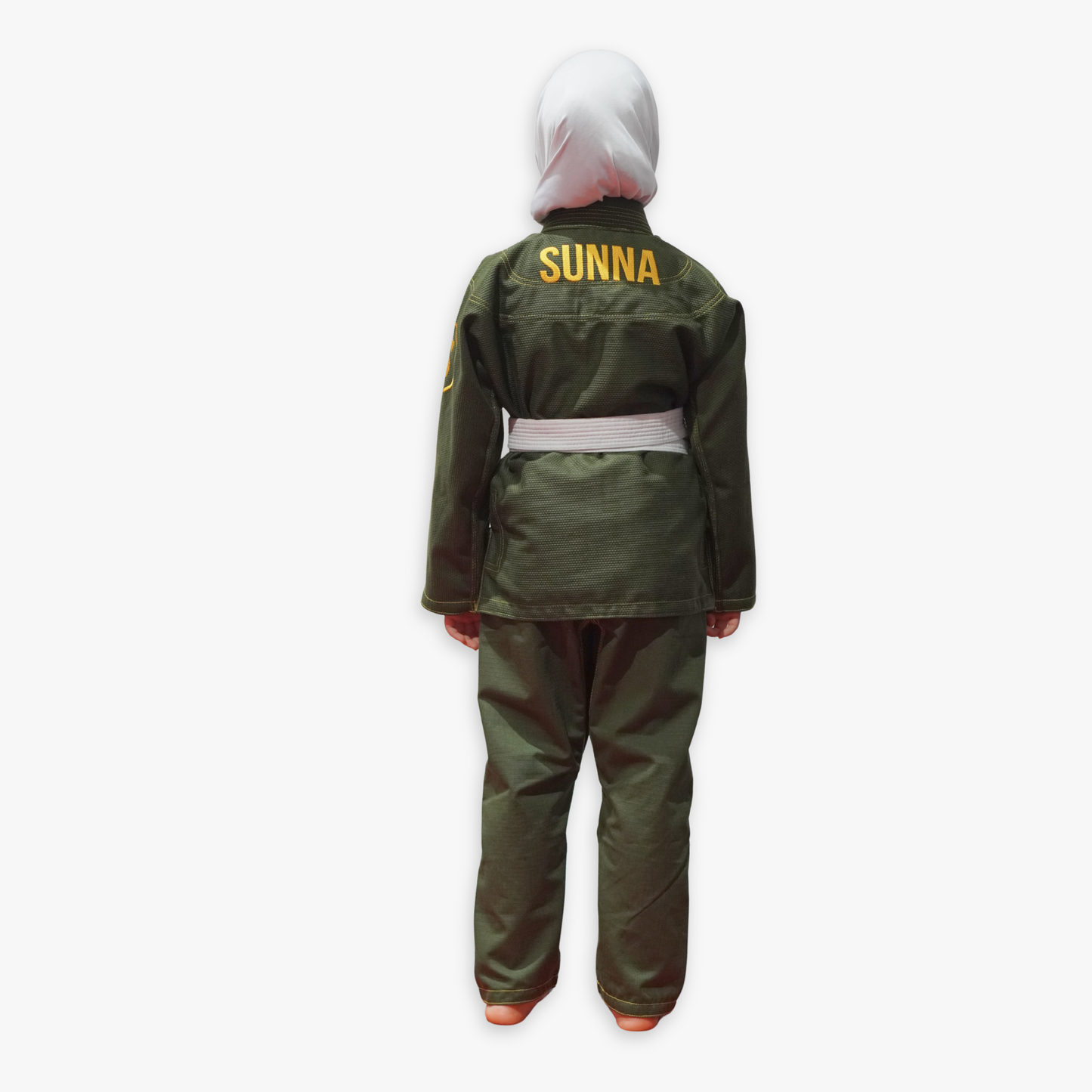 Child wearing a green outfit with 'SUNNA' on the back against a white background