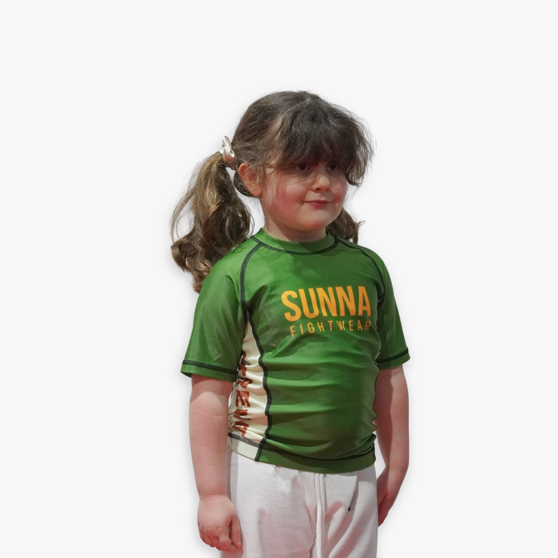 Child wearing a green Sunna Fightwear rashguard on a white background